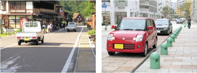 狭い生活道路を走る軽トラックと軽乗用車